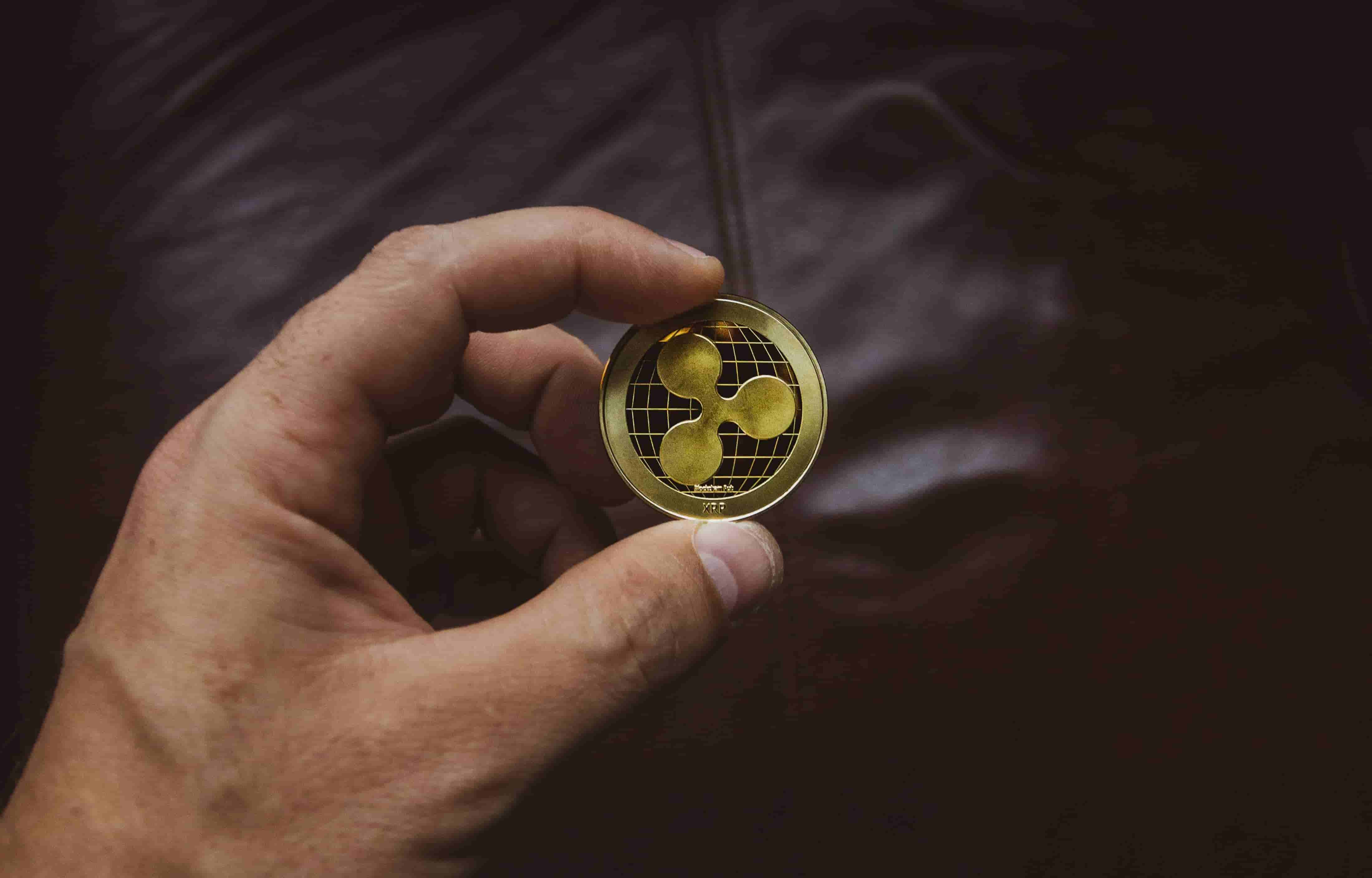 A guy conserving a Ripple coin.